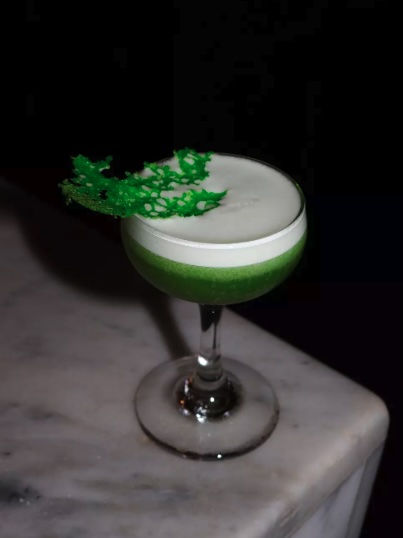 Interior of Cookie Bar Melbourne with warm lighting, vintage décor, and patrons enjoying cocktails at the bustling bar