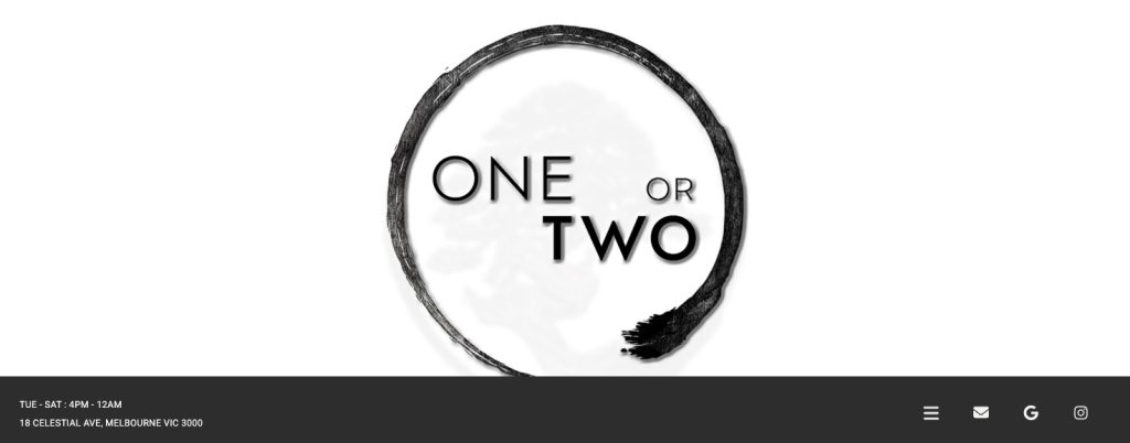 Minimalist interior of One or Two Melbourne with soft lighting, modern design, and a signature cocktail served on the counter