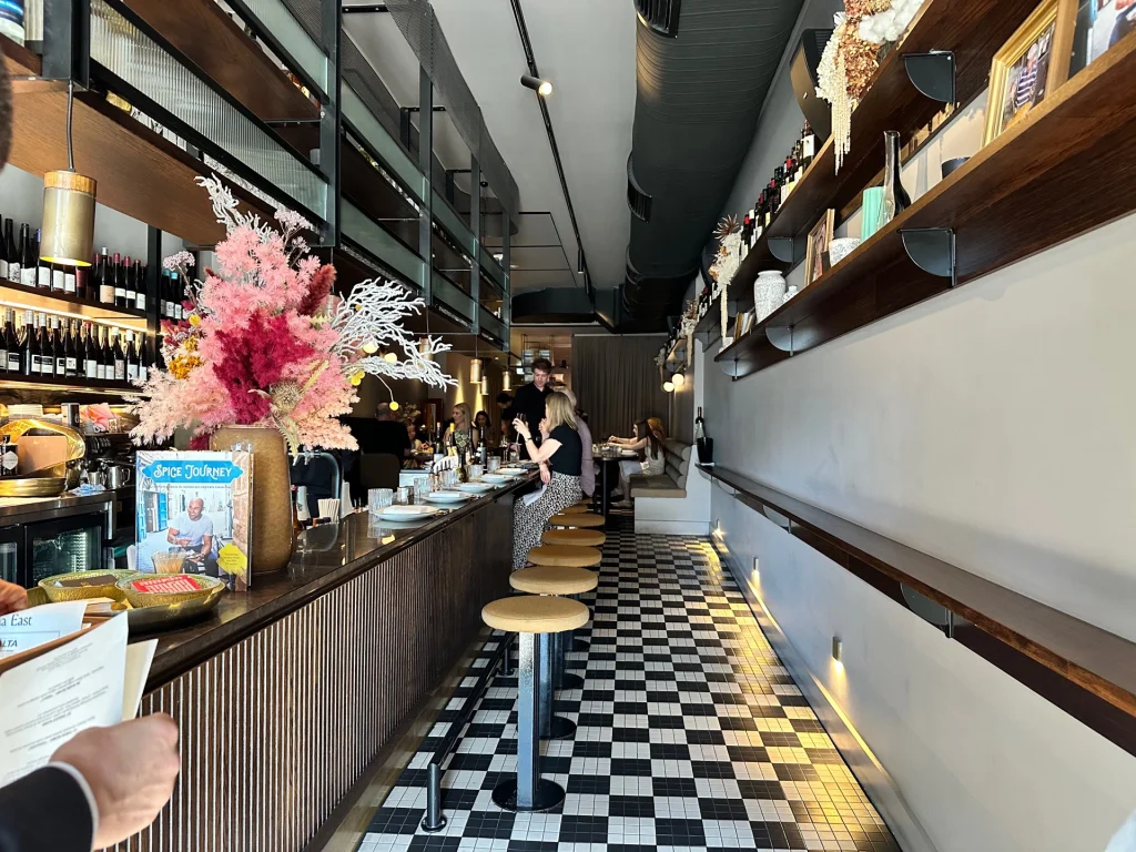 Maltese Feast dishes include fish, olives, dip, donuts at Maha East