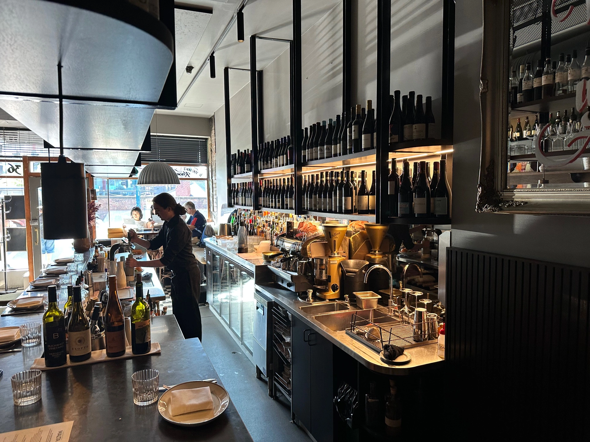 Maltese Feast dishes include fish, olives, dip, donuts at Maha East