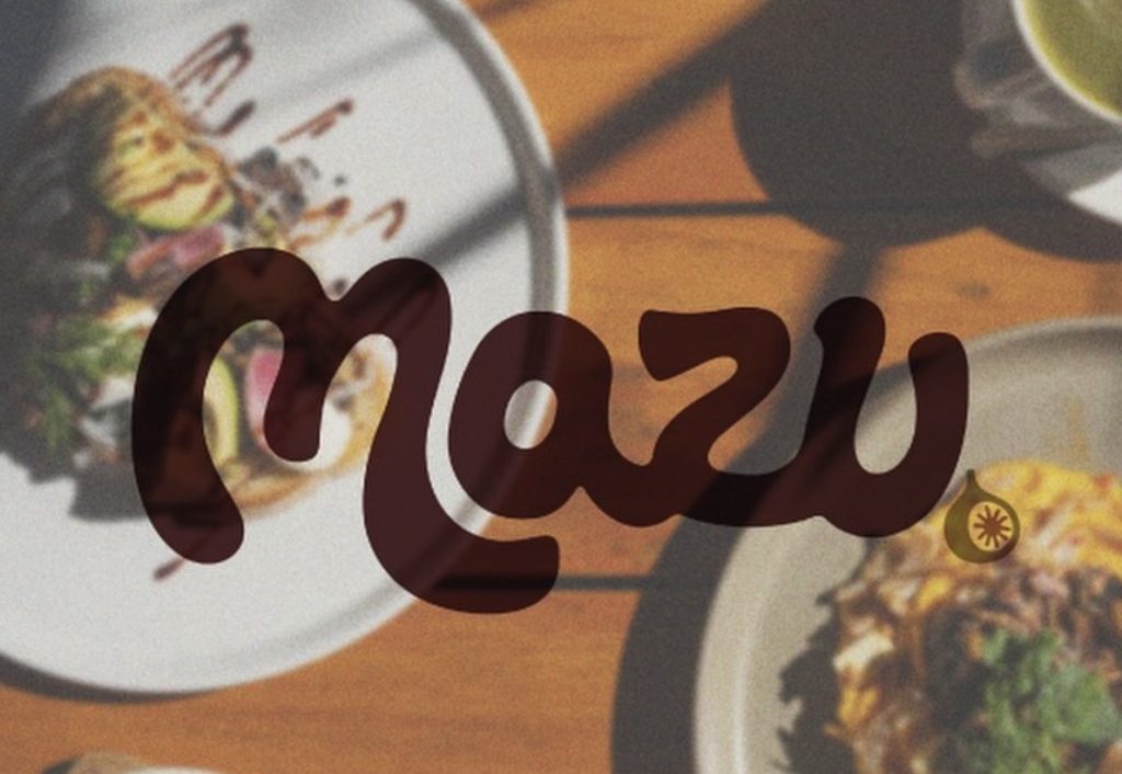 A busy Melbourne café during brunch service, with diners enjoying coffee and plates of food in a bright, modern space