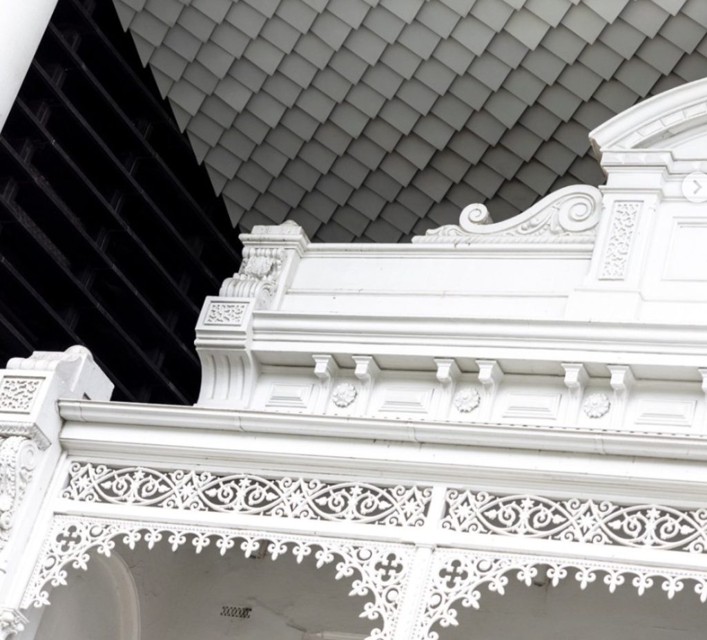 A busy Melbourne café during brunch service, with diners enjoying coffee and plates of food in a bright, modern space